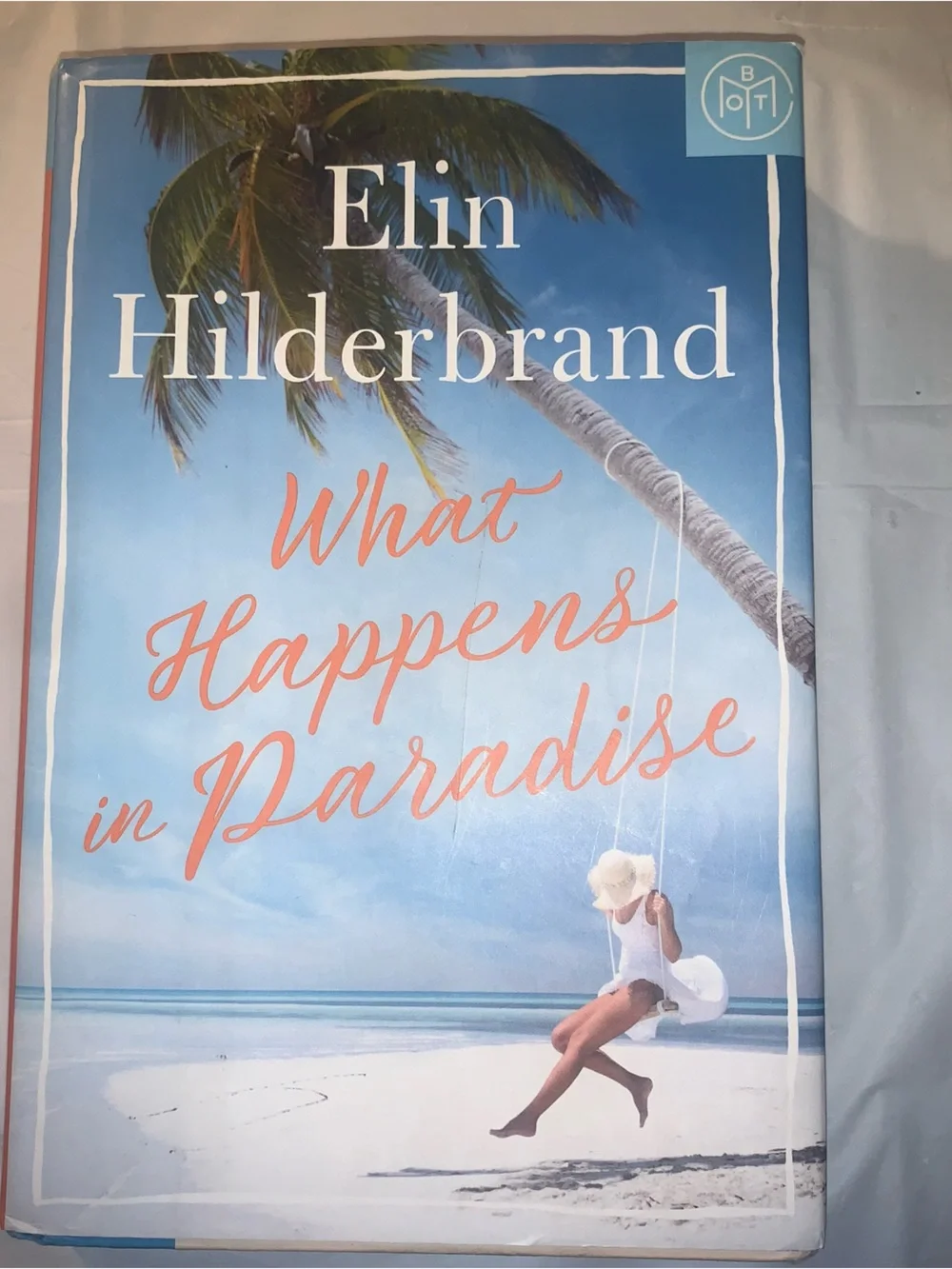 What Happens in Paradise by Elin Hilderbrand - Blue & Coral Beach Cover